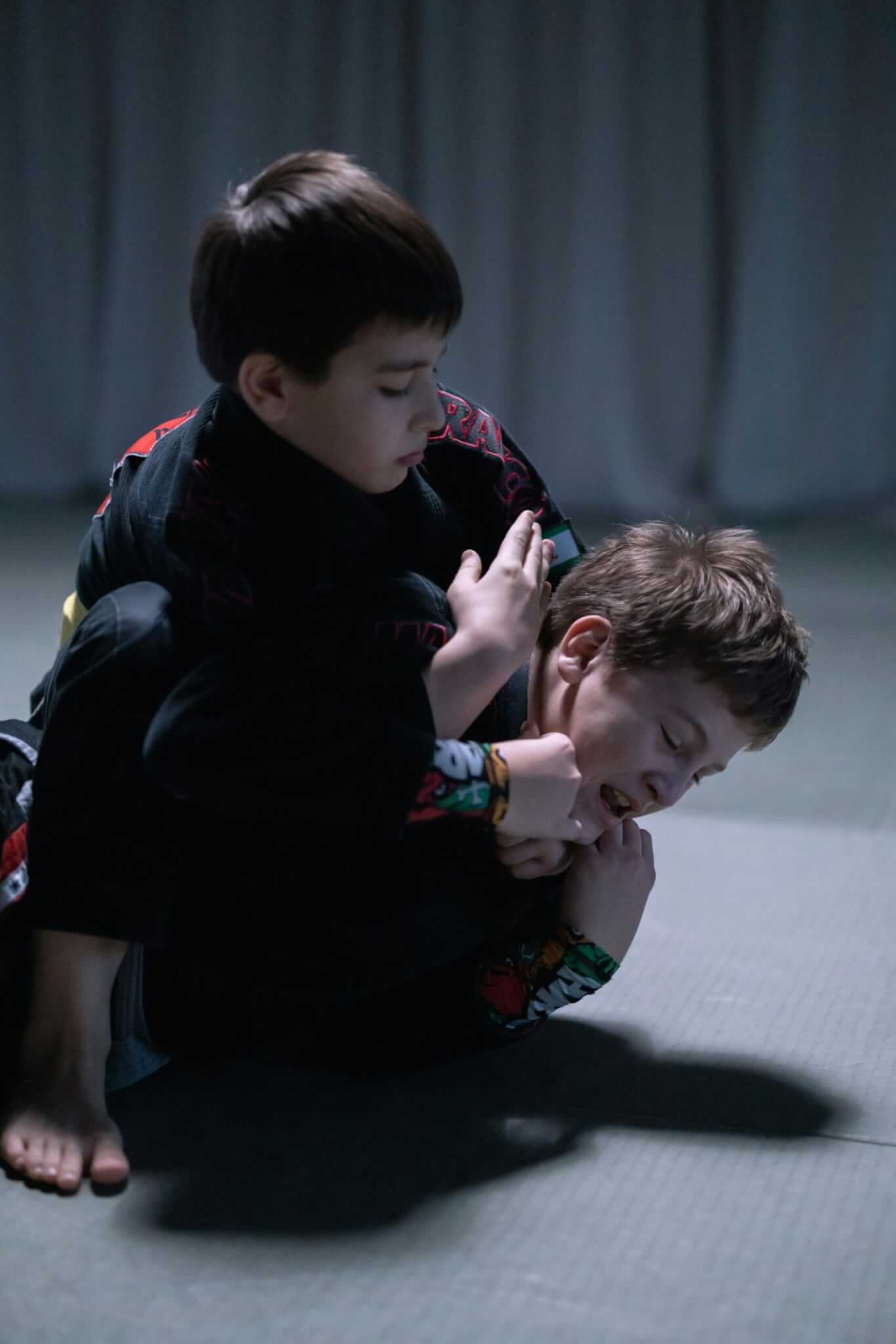 MMA boy applying rear choke