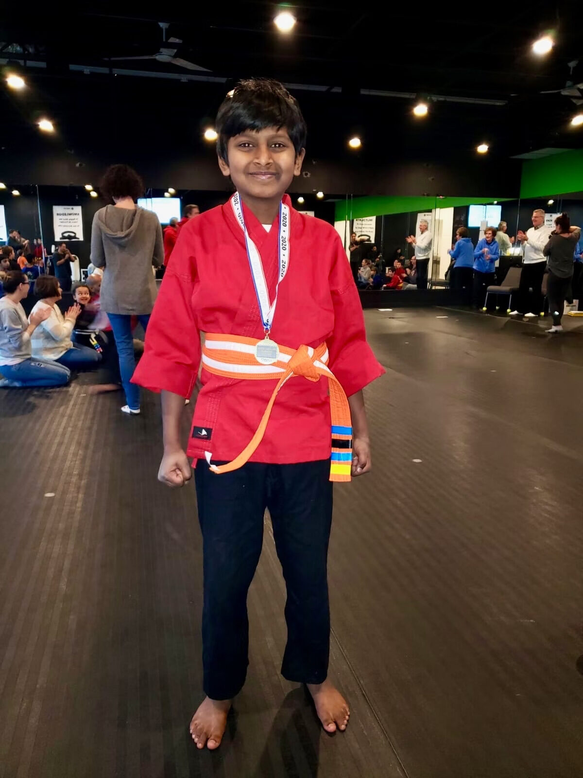 Lochan Alathur at Orange Belt showing his martial arts progress